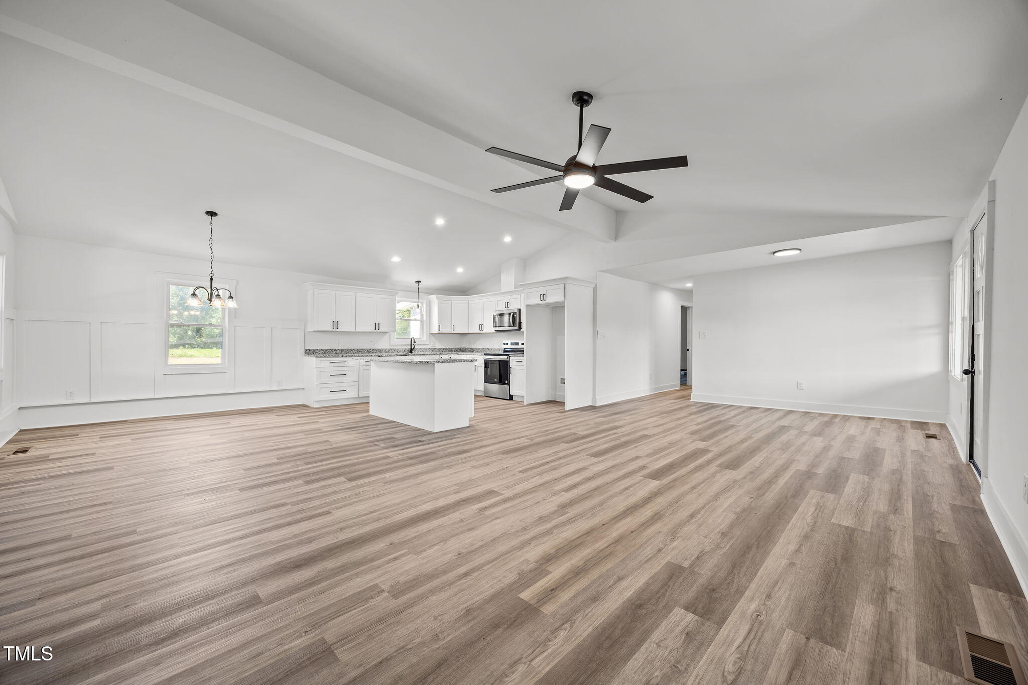 1161 Stewart Road Dunn, NC 28334 - Photo 21 of 50 a view of a kitchen with a sink dishwasher a refrigerator with wooden floor and chandelier