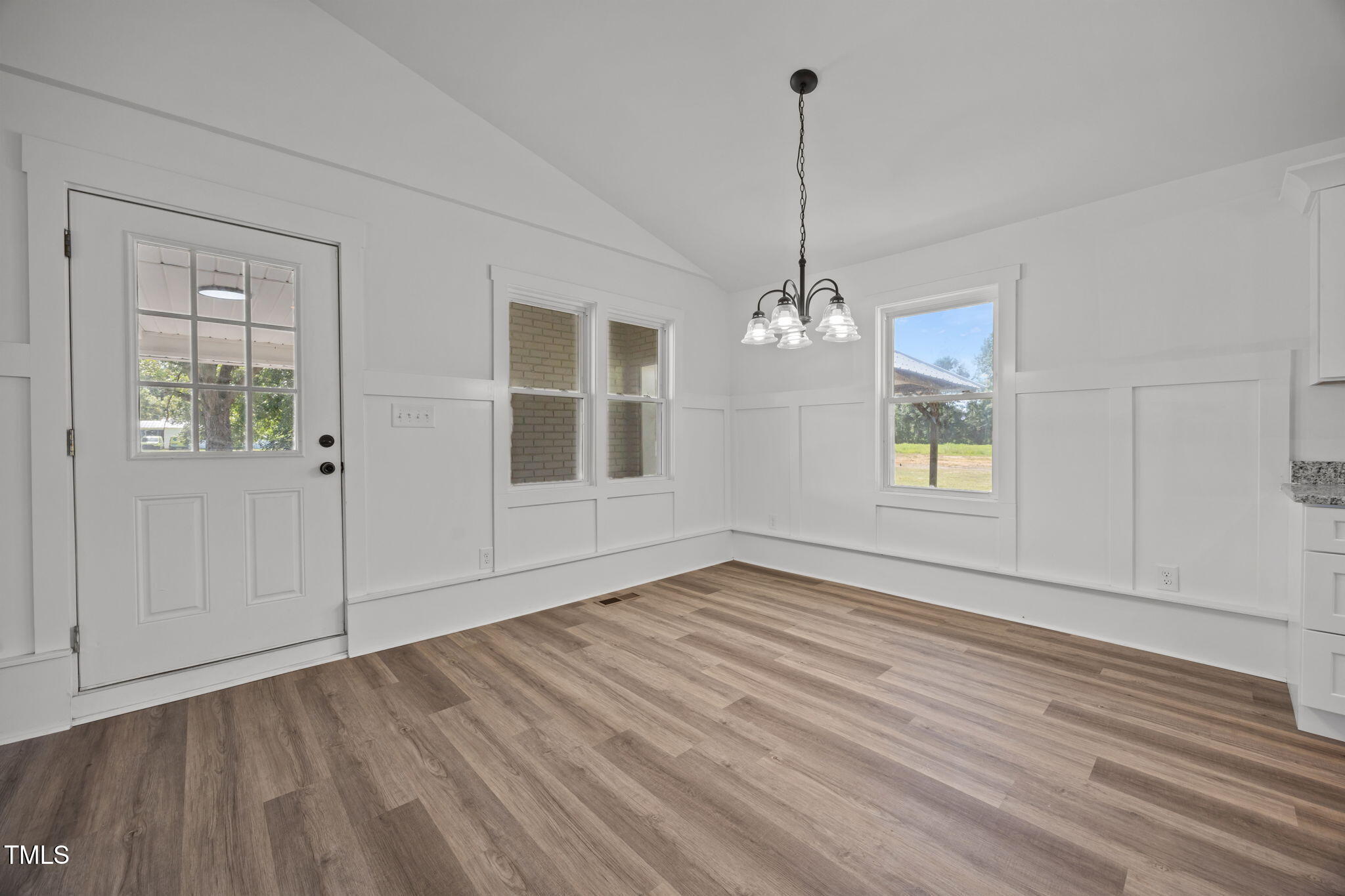 1161 Stewart Road Dunn, NC 28334 - Photo 23 of 50 a view of empty room with wooden floor and fan