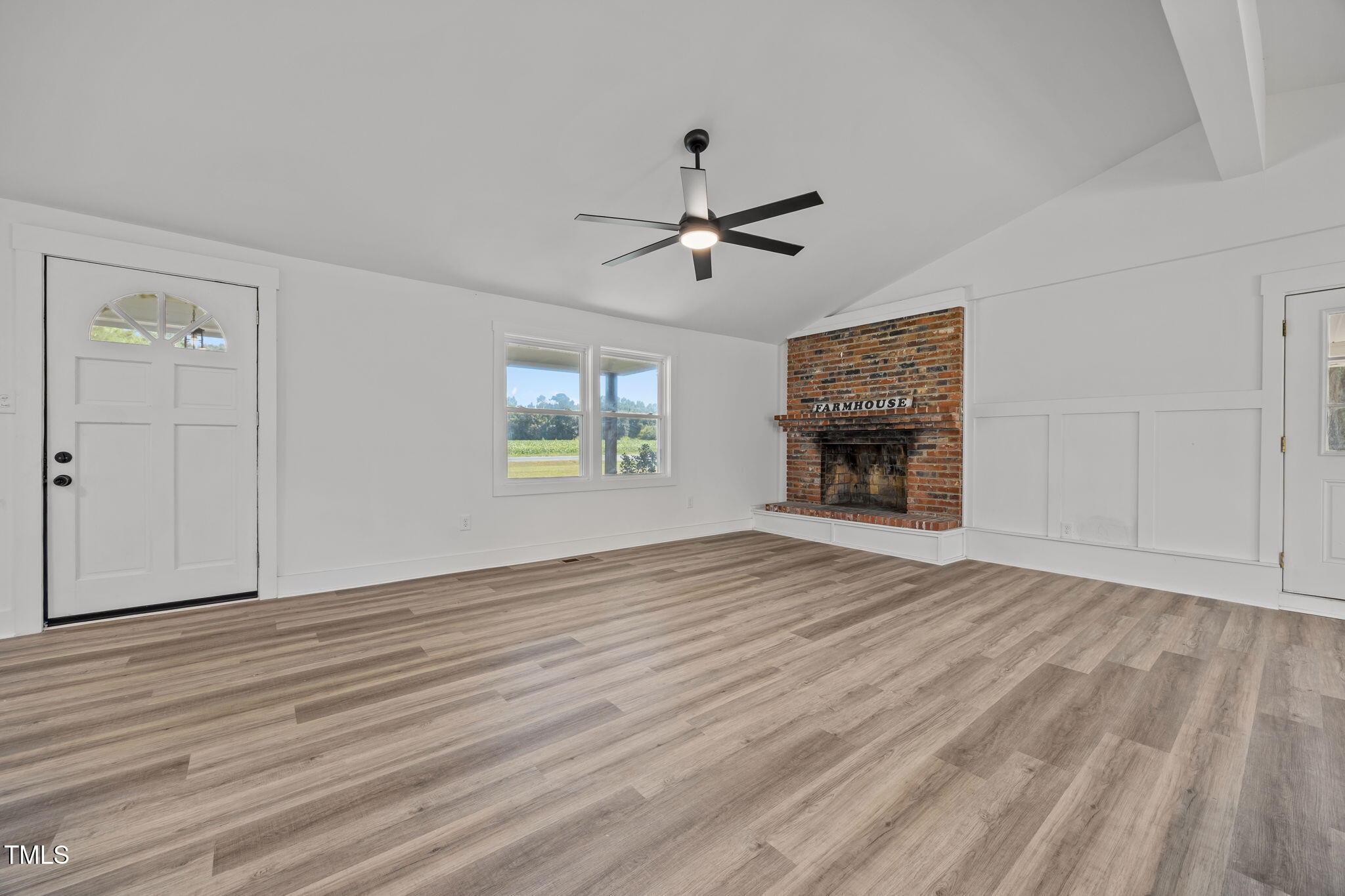 1161 Stewart Road Dunn, NC 28334 - Photo 27 of 50 an empty room with windows and a fireplace