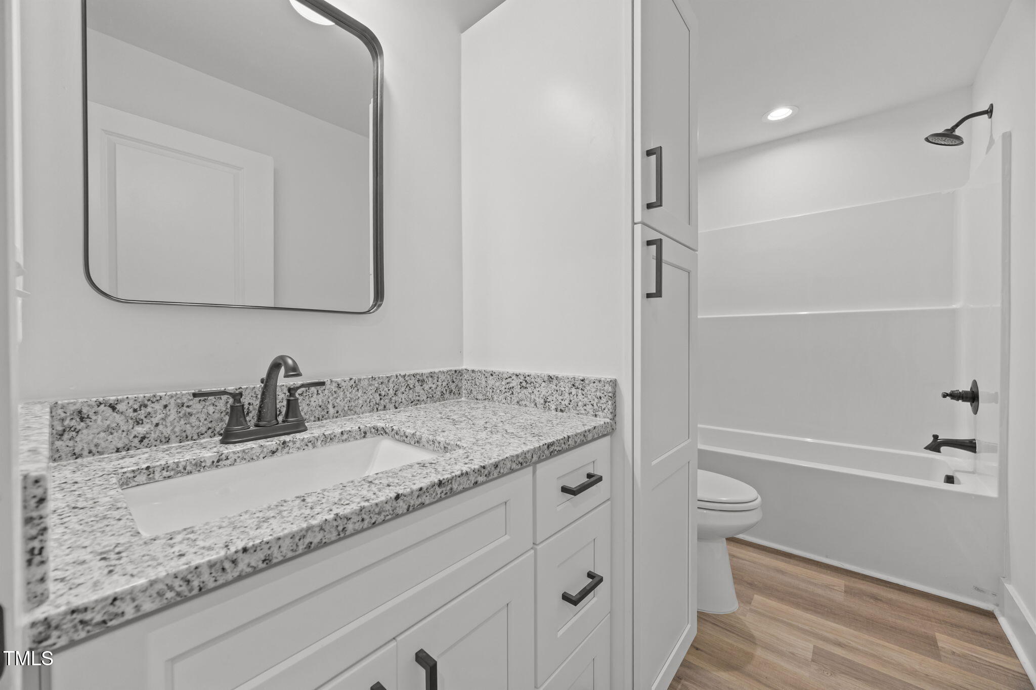 1161 Stewart Road Dunn, NC 28334 - Photo 32 of 50 a bathroom with a granite countertop sink toilet and shower