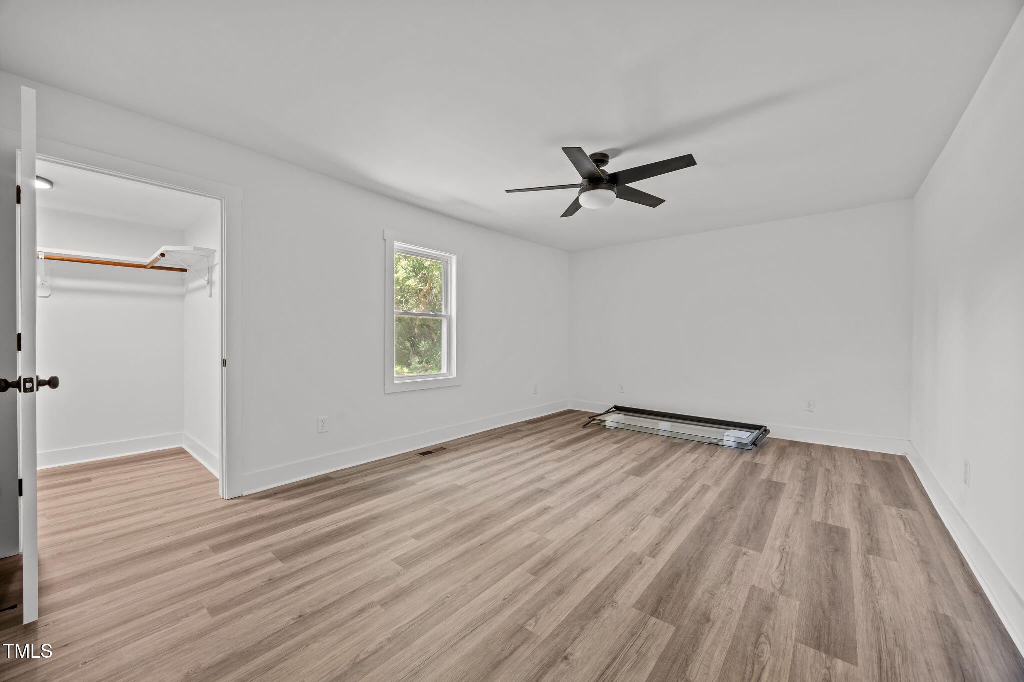 1161 Stewart Road Dunn, NC 28334 - Photo 35 of 50 wooden floor in an empty room with a window