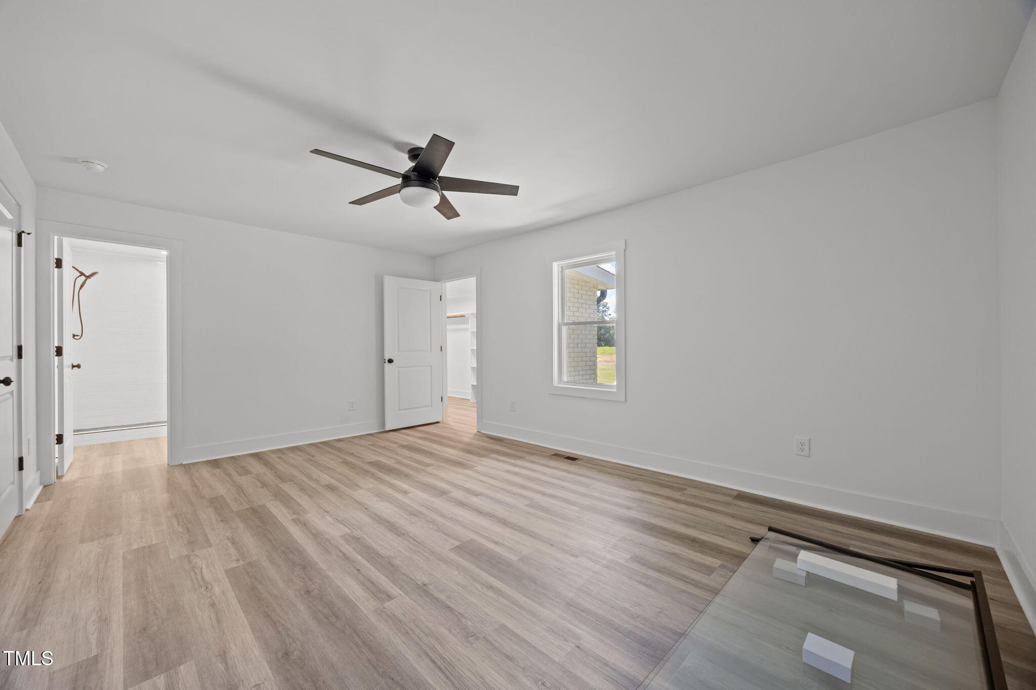 1161 Stewart Road Dunn, NC 28334 - Photo 36 of 50 a view of empty room with wooden floor and fan