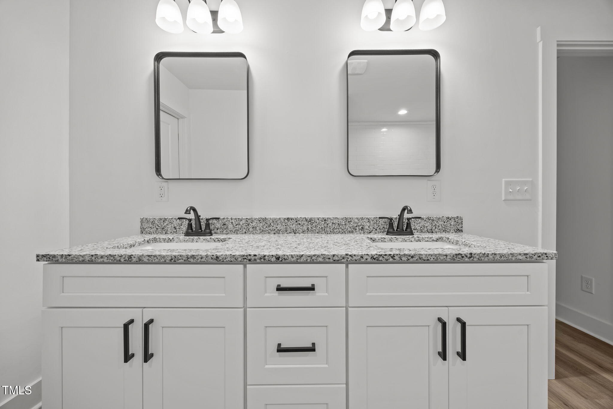 1161 Stewart Road Dunn, NC 28334 - Photo 40 of 50 a bathroom with double sink and a mirror