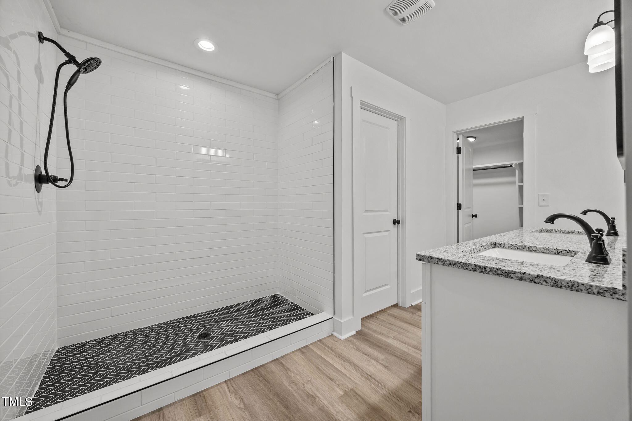 1161 Stewart Road Dunn, NC 28334 - Photo 41 of 50 a bathroom with a granite countertop sink and a shower