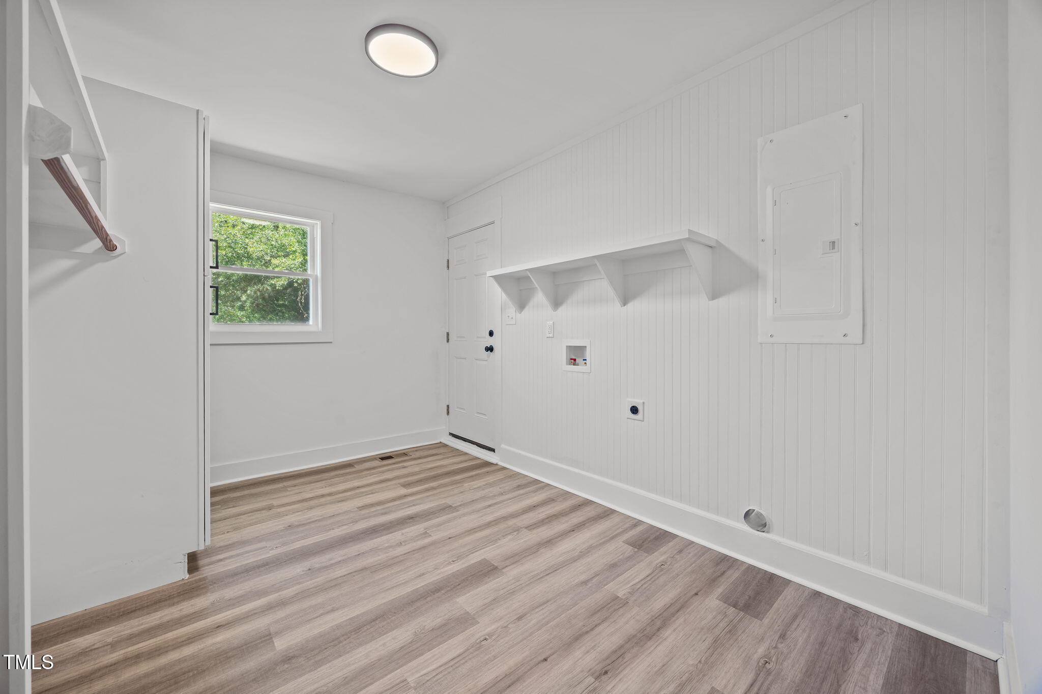 1161 Stewart Road Dunn, NC 28334 - Photo 43 of 50 an empty room with wooden floor and windows