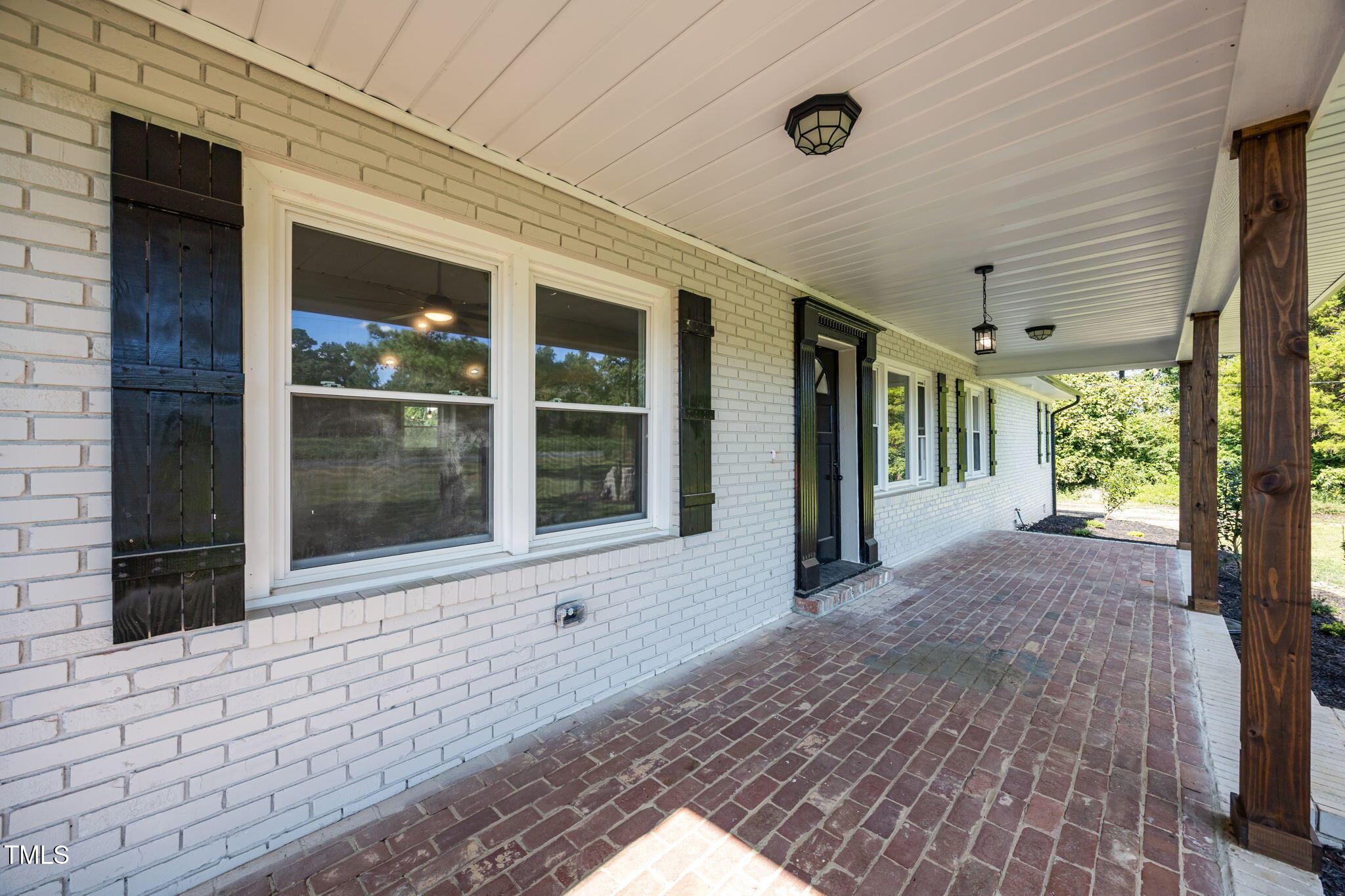 1161 Stewart Road Dunn, NC 28334 - Photo 45 of 50 a view of a house with a porch