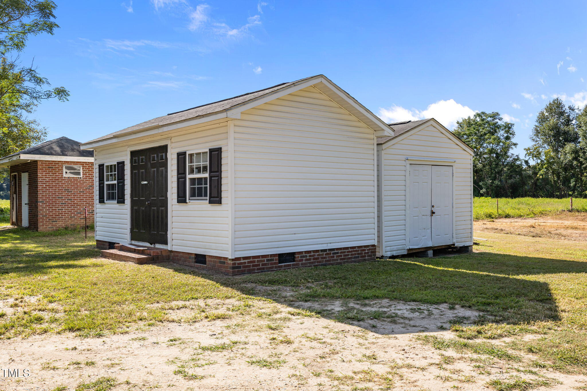 1161 Stewart Road Dunn, NC 28334 - Photo 47 of 50 a view of a house with a yard