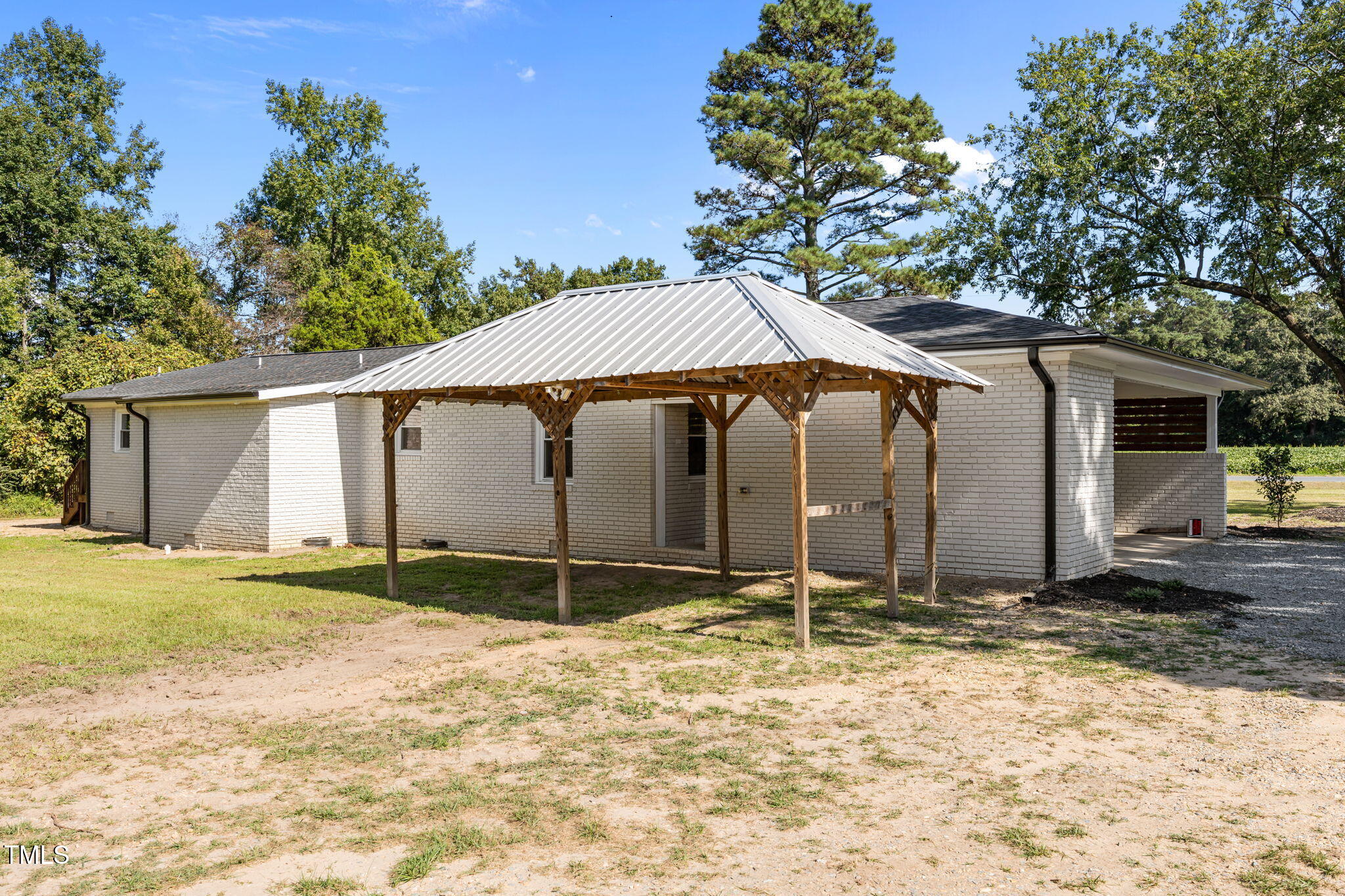 1161 Stewart Road Dunn, NC 28334 - Photo 48 of 50 a house that has a tree in front of it