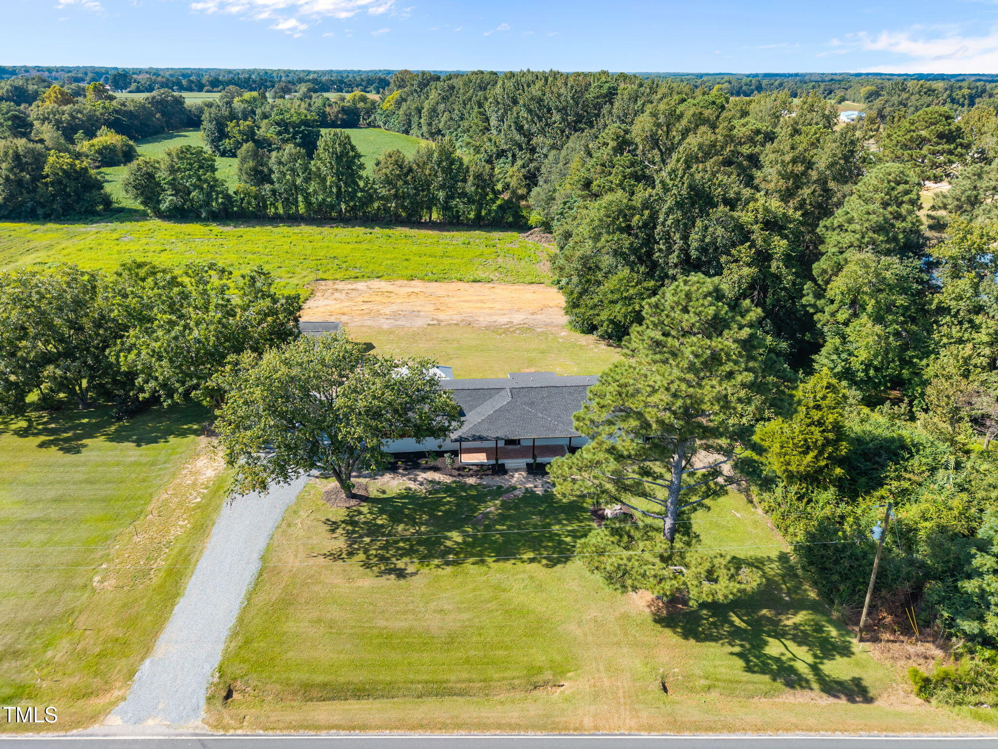 1161 Stewart Road Dunn, NC 28334 - Photo 5 of 50 a view of a lake with a yard