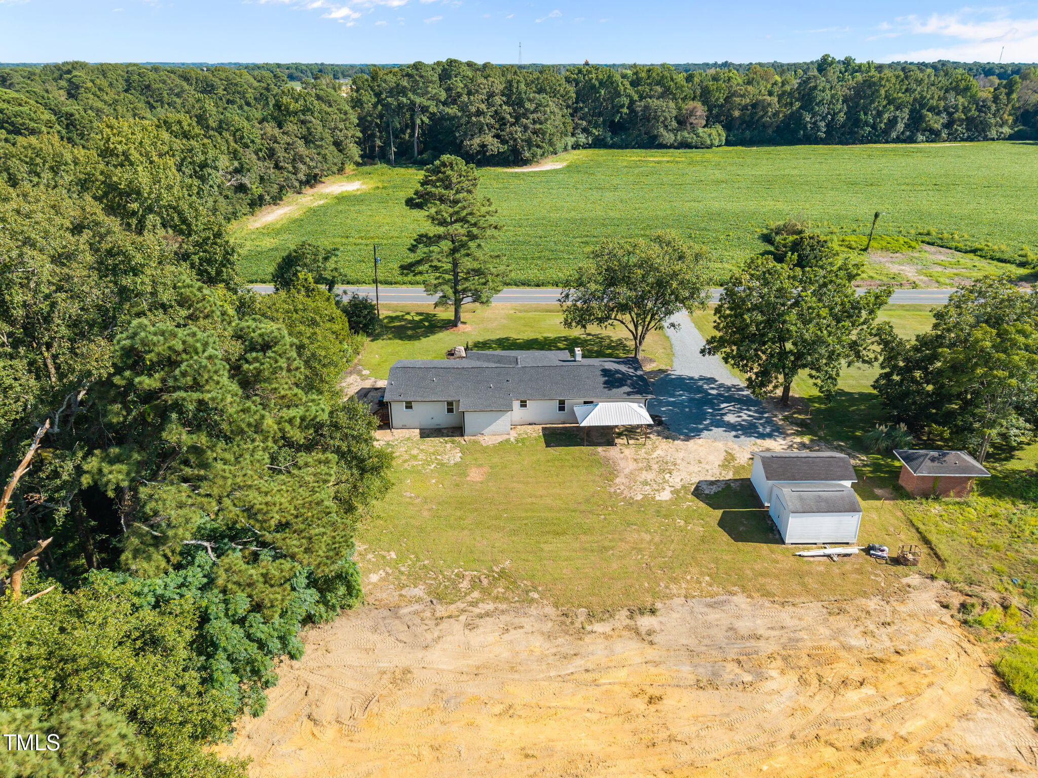 1161 Stewart Road Dunn, NC 28334 - Photo 6 of 50 a view of a lake with a yard