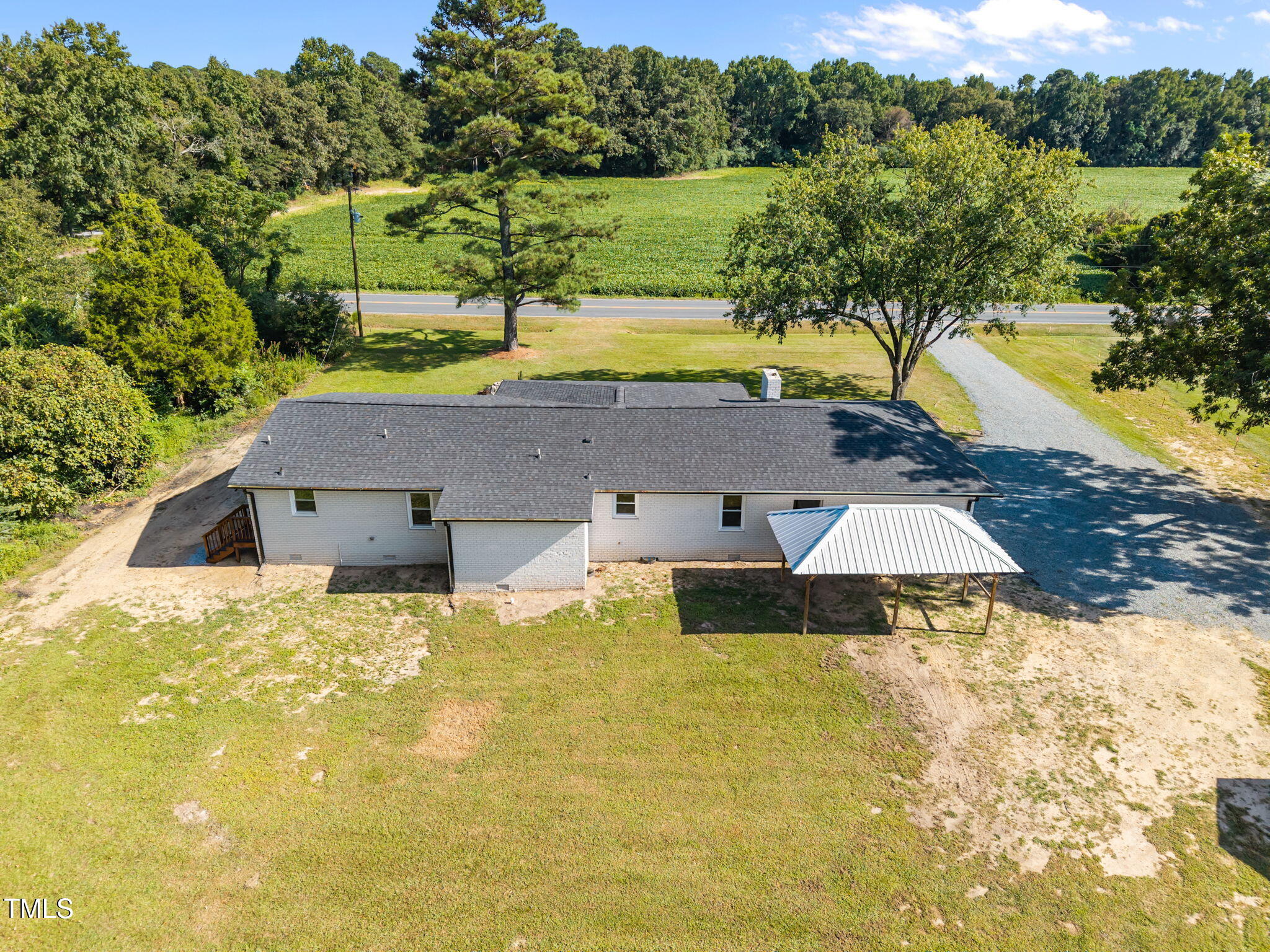 1161 Stewart Road Dunn, NC 28334 - Photo 9 of 50 a view of a swimming pool with a yard