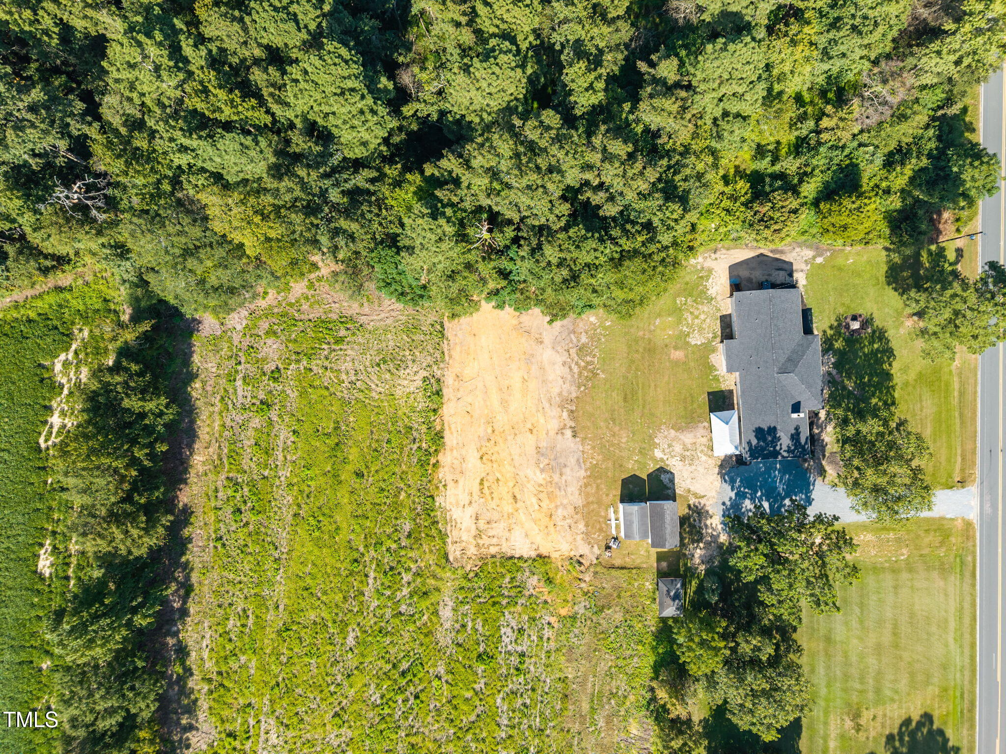1161 Stewart Road Dunn, NC 28334 - Photo 10 of 50 a building view with a garden