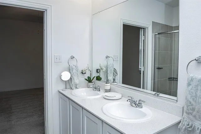 a bathroom with a sink and a mirror