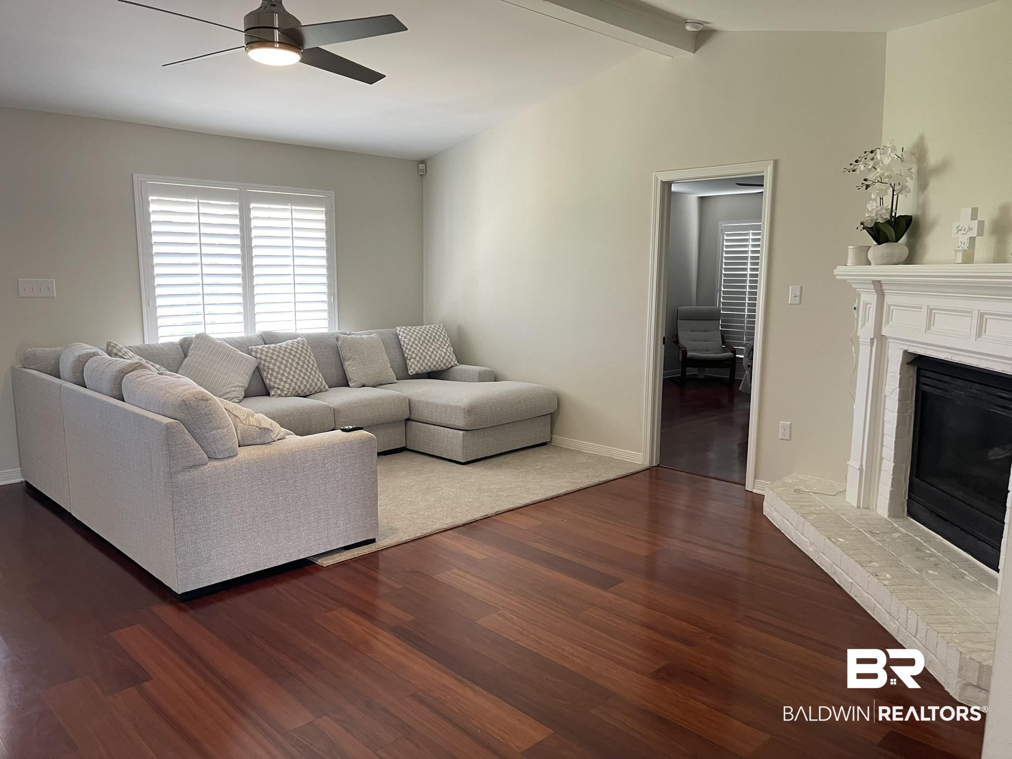 35405 Pine Road South Stapleton, AL 36578 - Photo 6 of 29 Living room with a fireplace, ceiling fan, dark wood finished floors, and beam ceiling