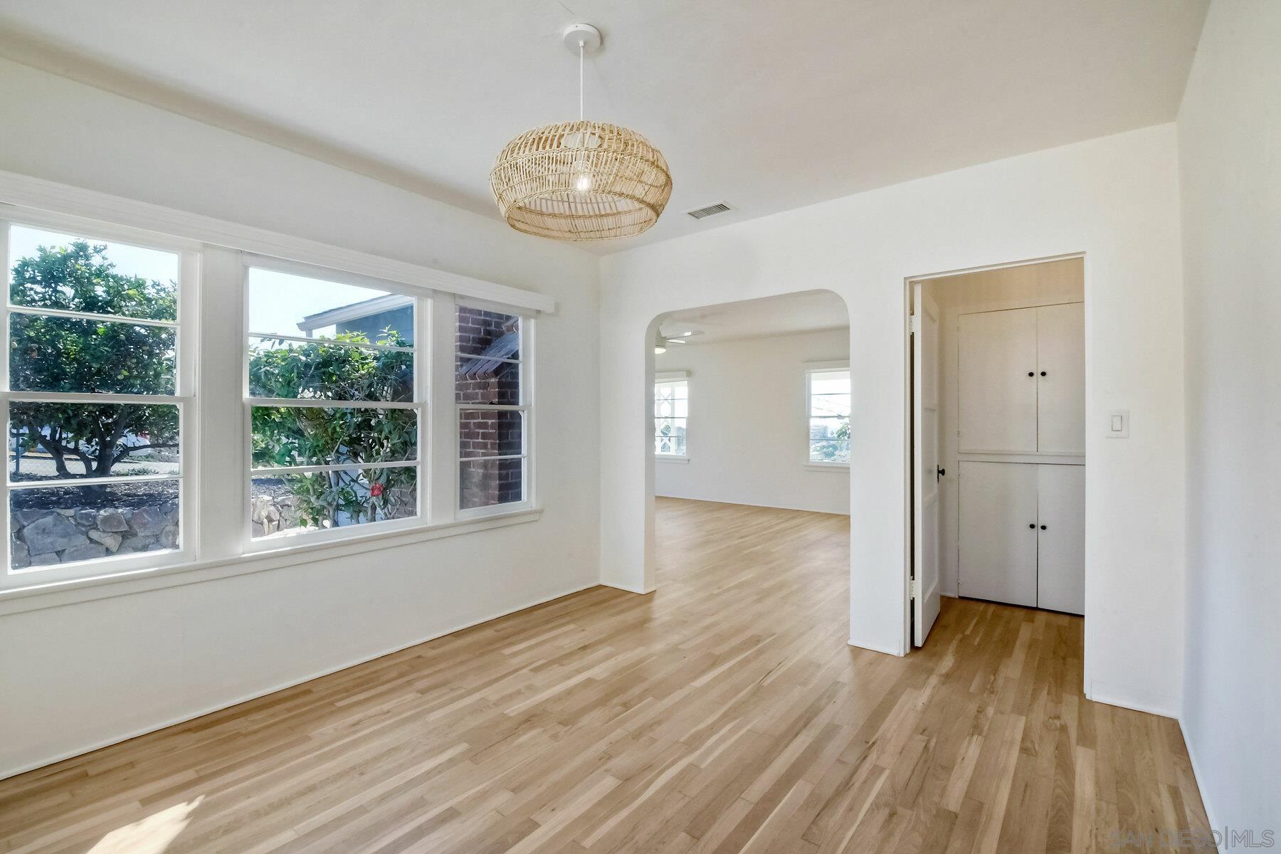 855 Dewitt Avenue Encinitas, CA 92024 - Photo 11 of 23 a view of an empty room with wooden floor and a window