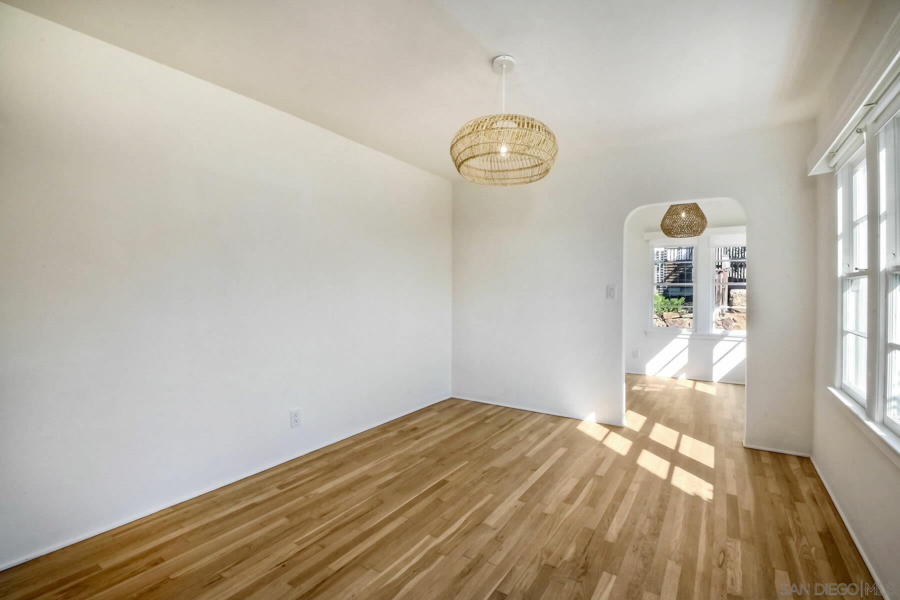 855 Dewitt Avenue Encinitas, CA 92024 - Photo 12 of 23 a view of empty room with wooden floor