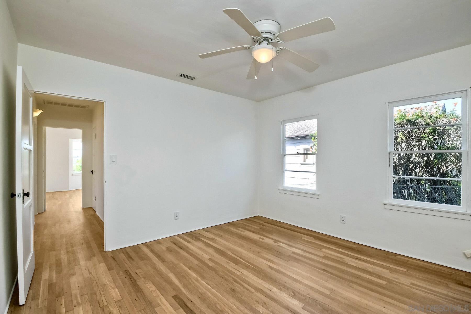 855 Dewitt Avenue Encinitas, CA 92024 - Photo 18 of 23 a view of empty room with wooden floor and fan
