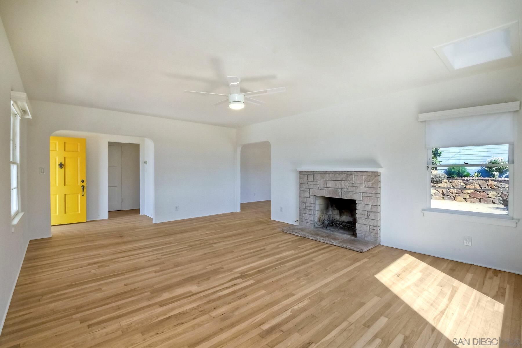 855 Dewitt Avenue Encinitas, CA 92024 - Photo 5 of 23 a view of an empty room with a fireplace and a window