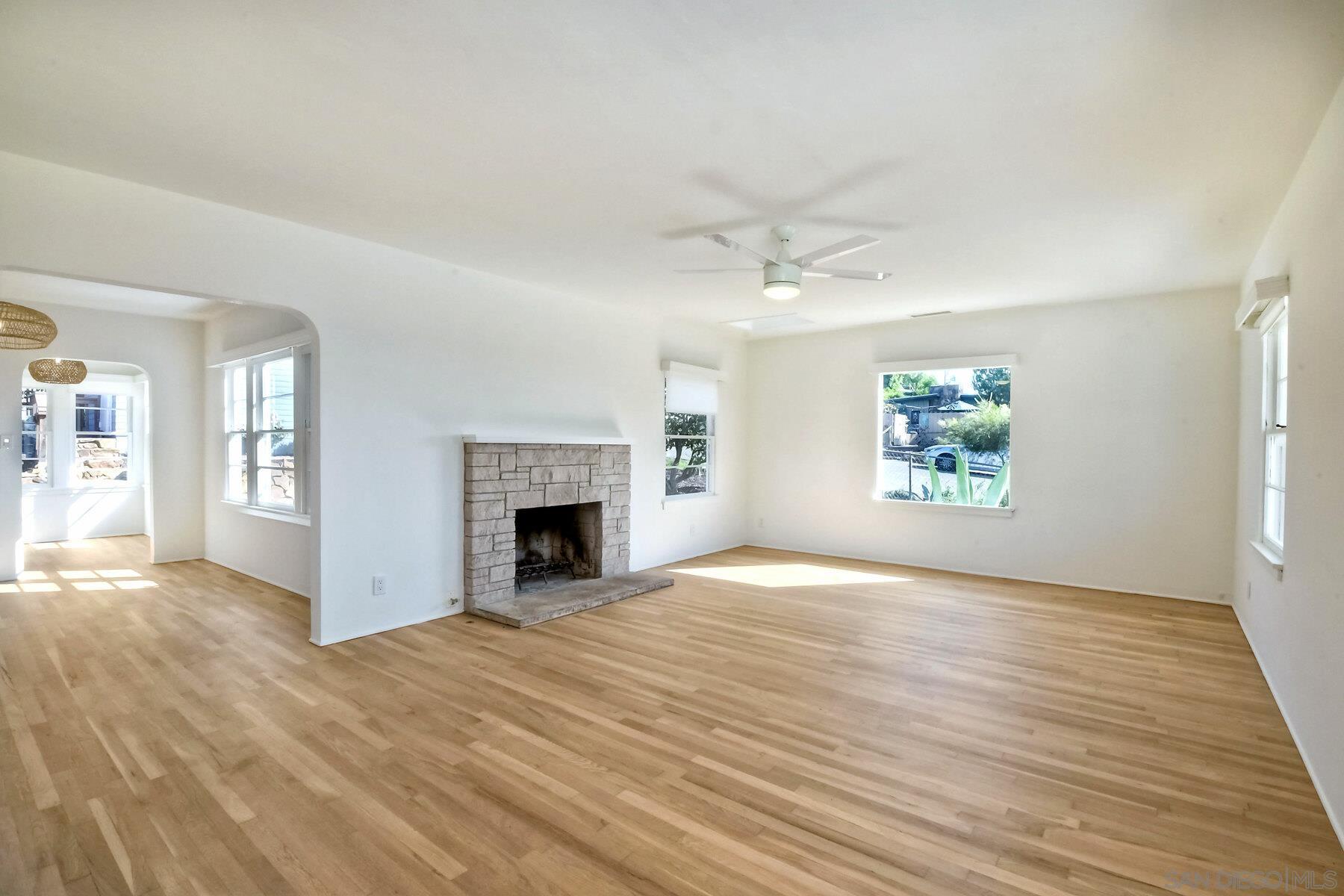 855 Dewitt Avenue Encinitas, CA 92024 - Photo 6 of 23 an empty room with windows and fireplace