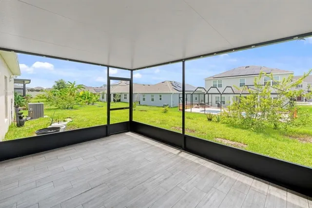 a view of an empty room with a large window