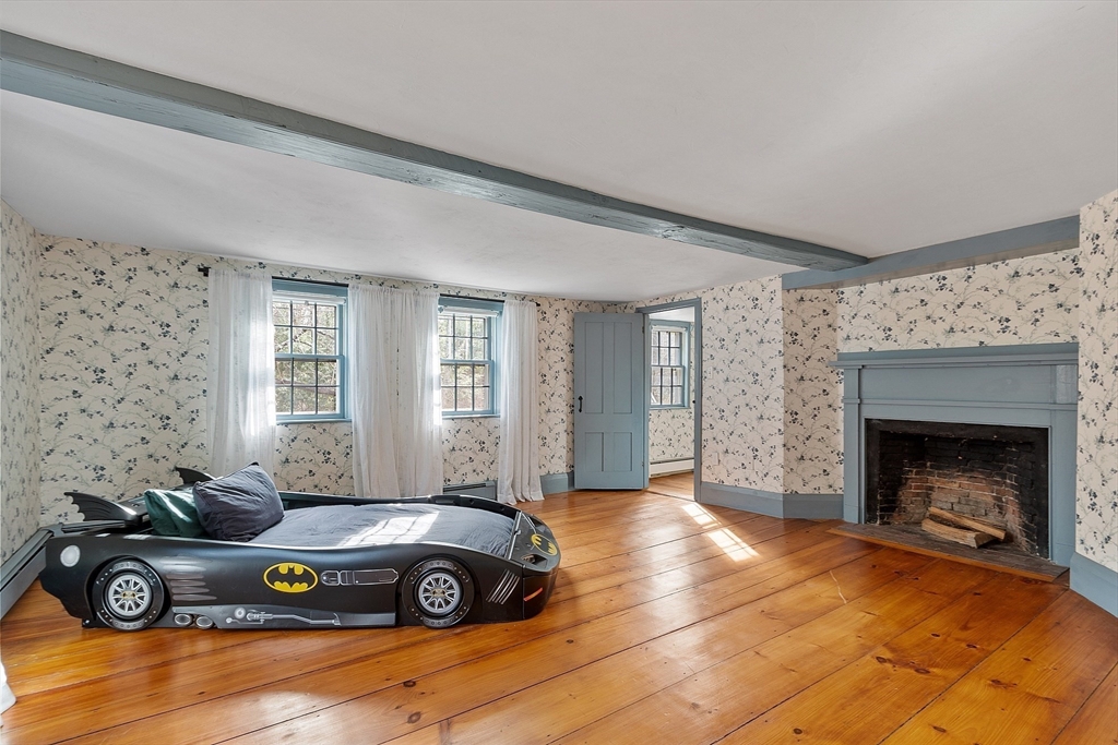 1019 North Road Carlisle, MA 01741 - Photo 19 of 31 a living room with furniture and a fireplace
