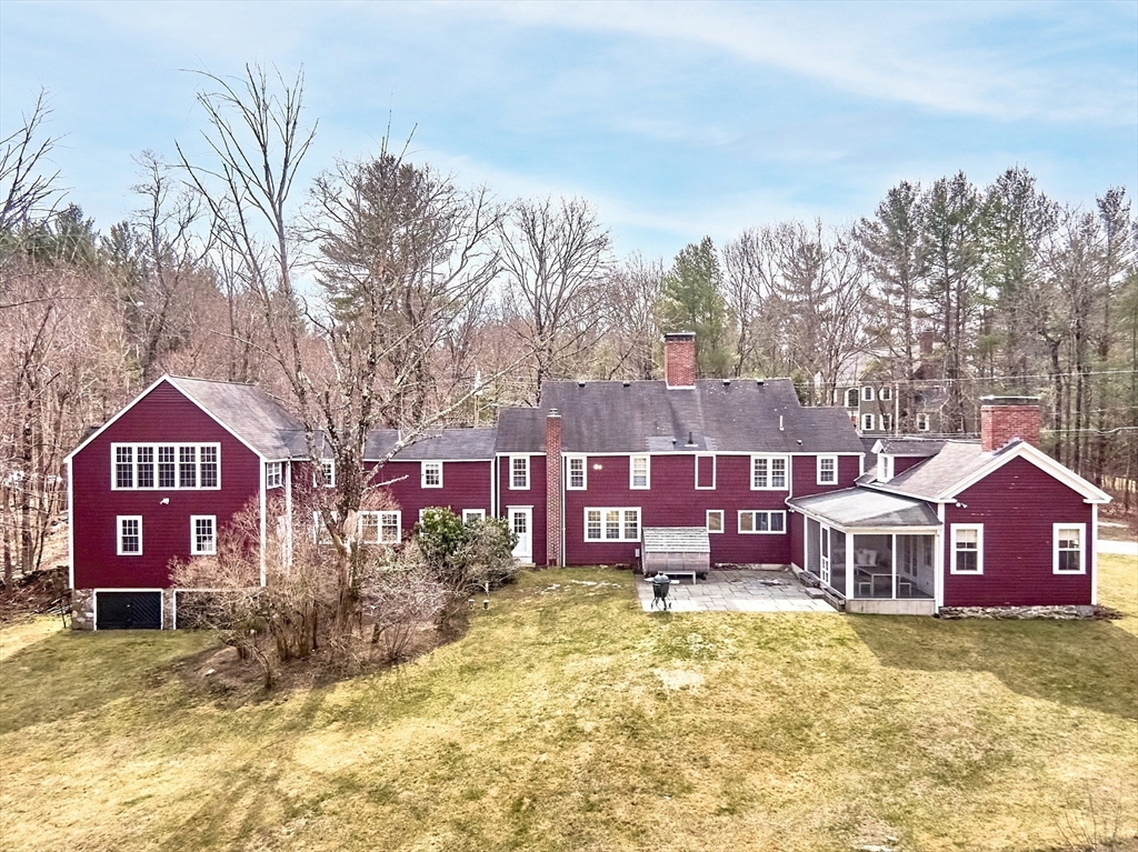 1019 North Road Carlisle, MA 01741 - Photo 29 of 31 a view of a house with a yard covered in snow