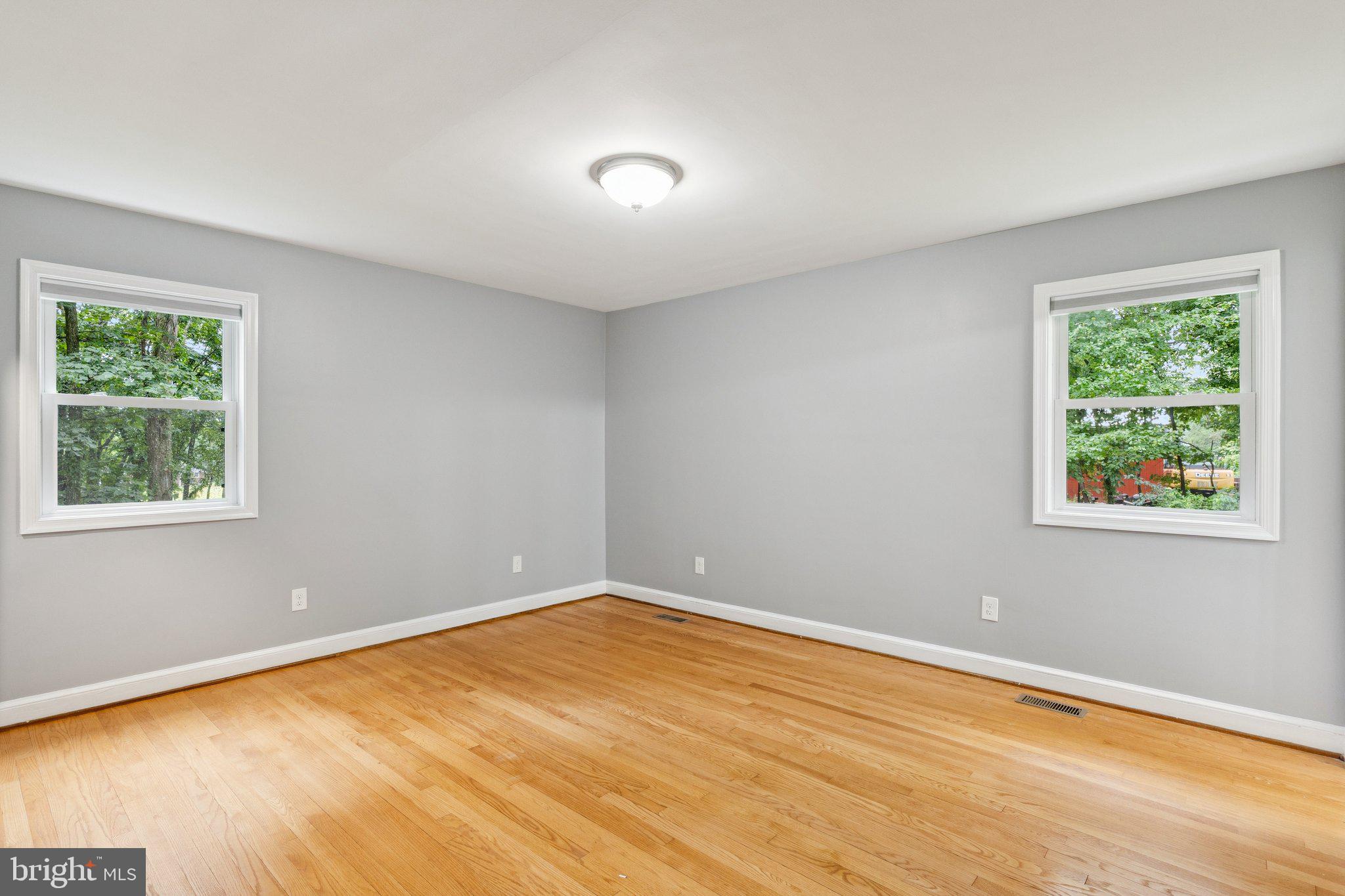 12645 Fingerboard Road Monrovia, MD 21770 - Photo 18 of 47 a view of an empty room with wooden floor and a window