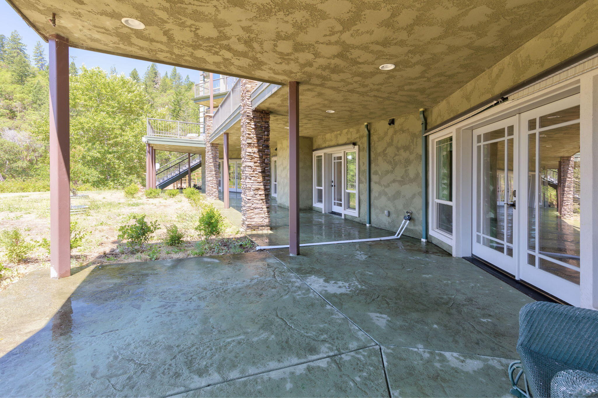 7304 North Applegate Road Grants Pass, OR 97527 - Photo 73 of 87 a view of a porch with furniture and floor to ceiling window