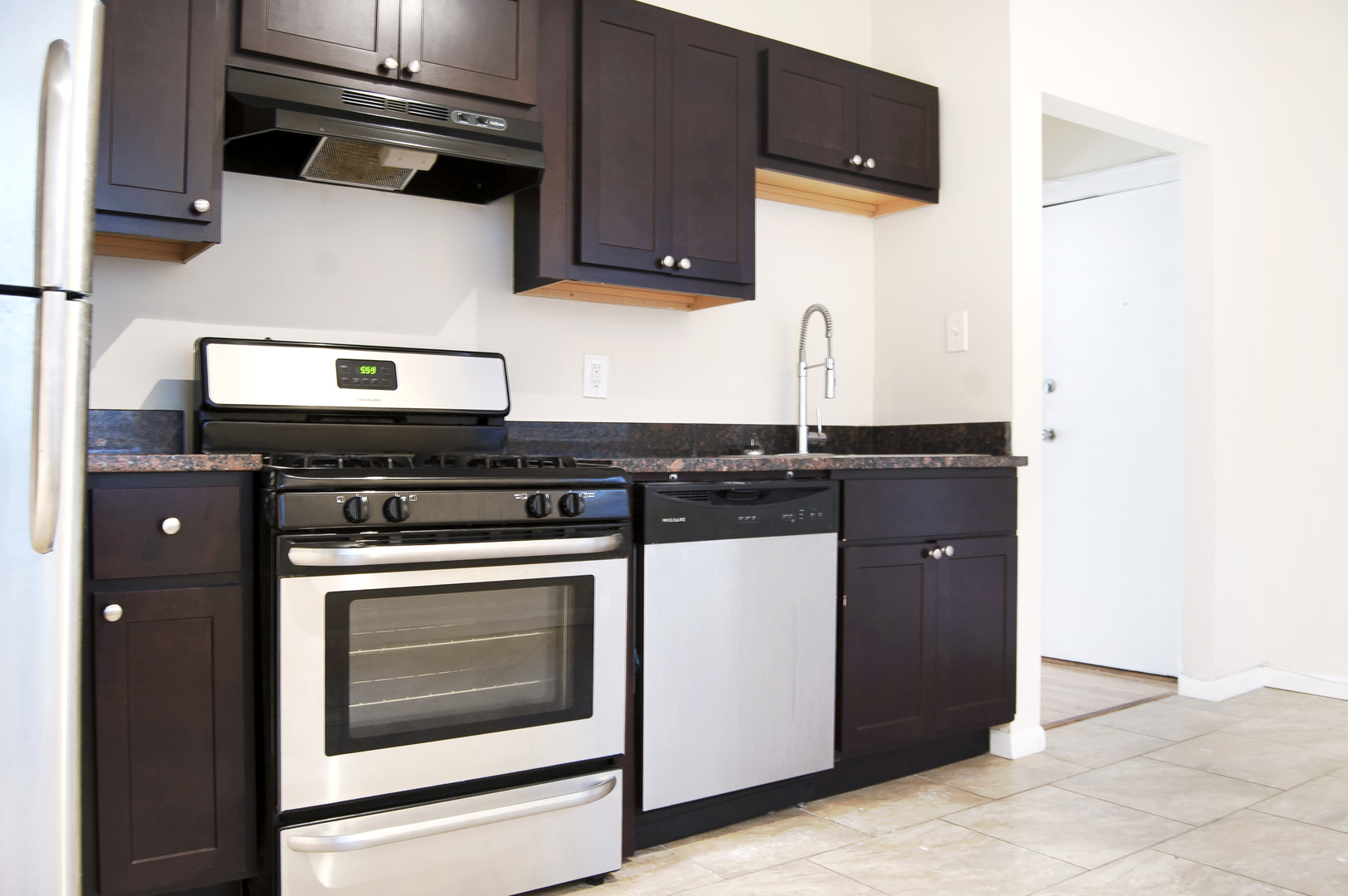 4823 North Springfield Avenue, Unit 2E Chicago, IL 60625 - Photo 6 of 6 a kitchen with stainless steel appliances granite countertop a stove and a microwave
