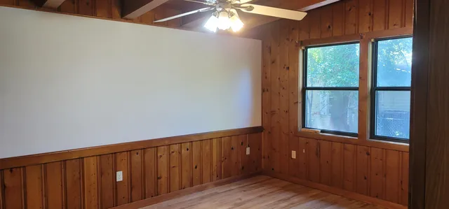 a view of balcony with wooden floor