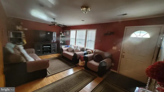 a living room with furniture fireplace and a flat screen tv