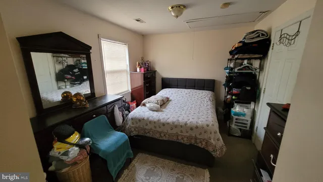 a bedroom with a bed and a closet