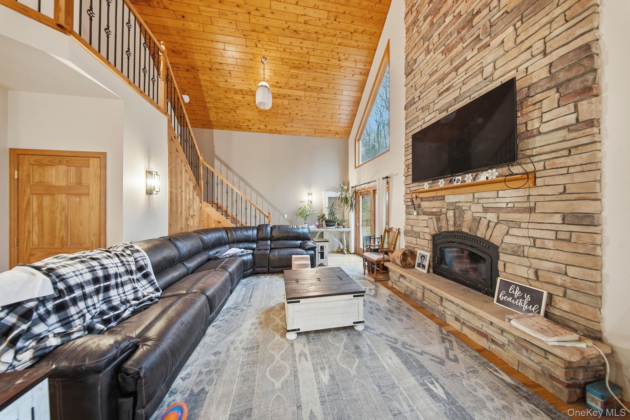 191 David Rhodes Road Wurtsboro, NY 12790 - Photo 16 of 39 a living room with furniture fireplace and flat screen tv