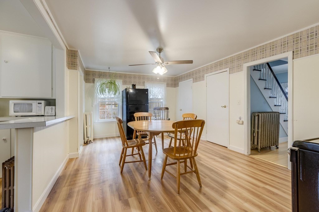 9 Trowbridge Circuit Worcester, MA 01603 - Photo 12 of 40 a view of a dining room with furniture and a wooden floor