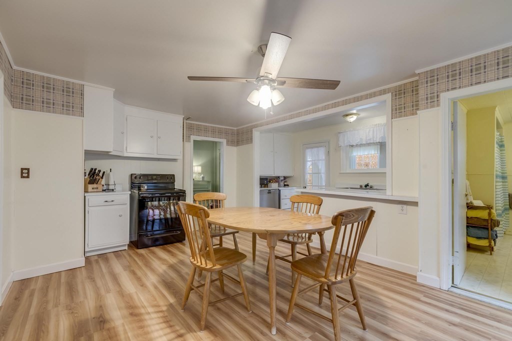 9 Trowbridge Circuit Worcester, MA 01603 - Photo 14 of 40 a view of a dining room with furniture and a kitchen