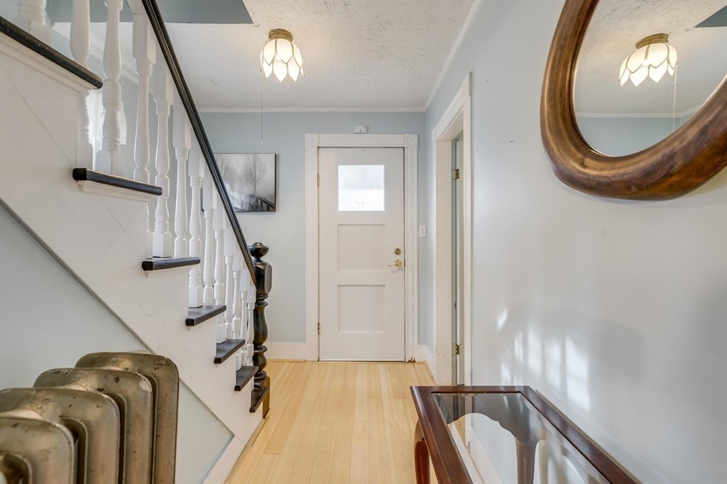 9 Trowbridge Circuit Worcester, MA 01603 - Photo 16 of 40 a view of a livingroom with furniture and stairs