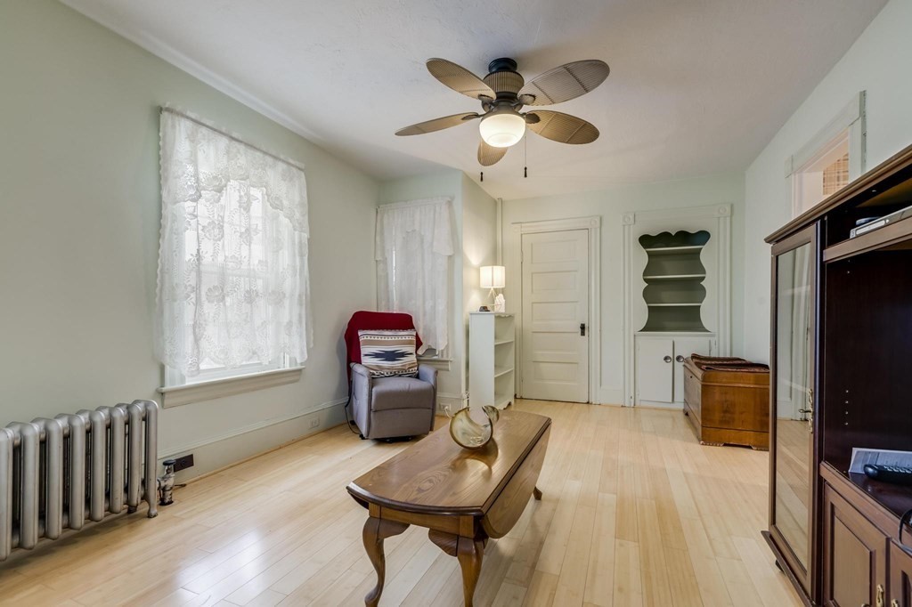 9 Trowbridge Circuit Worcester, MA 01603 - Photo 19 of 40 a living room with furniture and a flat screen tv