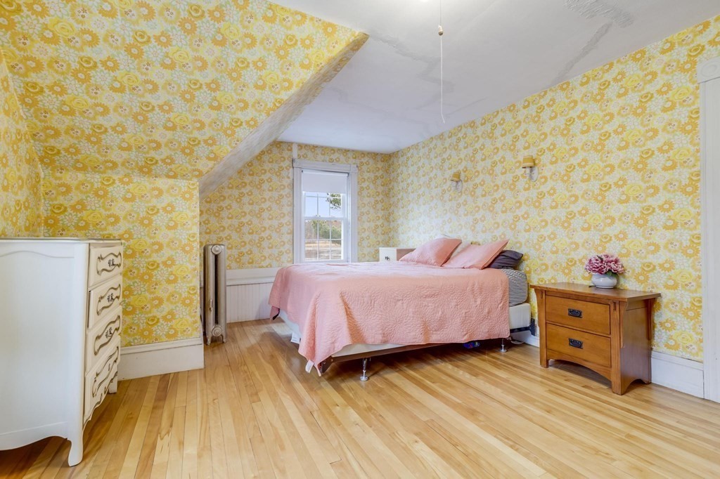 9 Trowbridge Circuit Worcester, MA 01603 - Photo 24 of 40 a bedroom with a bed and wooden floor