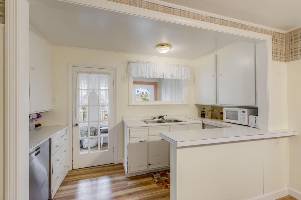 9 Trowbridge Circuit Worcester, MA 01603 - Photo 10 of 40 a room with a sink a washer and dryer