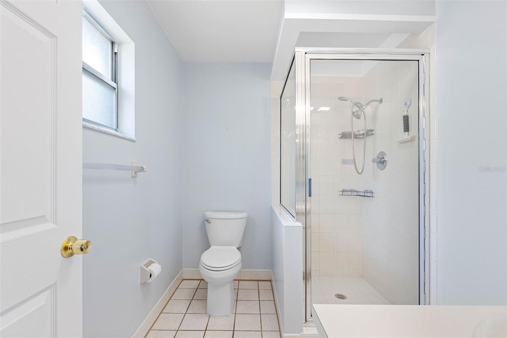 33237 Chancey Road Wesley Chapel, FL 33543 - Photo 27 of 59 a bathroom with a toilet and a shower