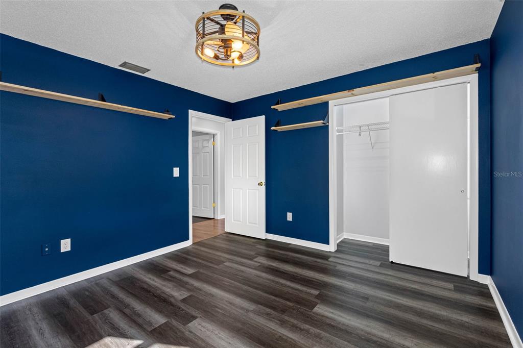 33237 Chancey Road Wesley Chapel, FL 33543 - Photo 29 of 59 a view of a room with wooden floor