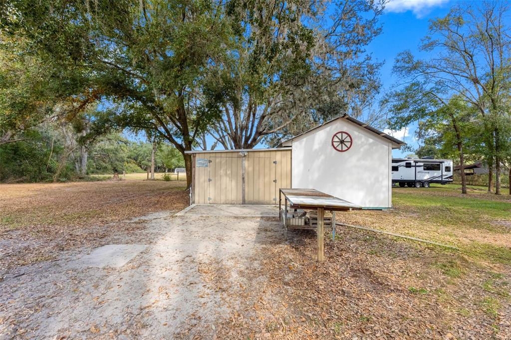33237 Chancey Road Wesley Chapel, FL 33543 - Photo 43 of 59 a sign that is sitting in the middle of a yard