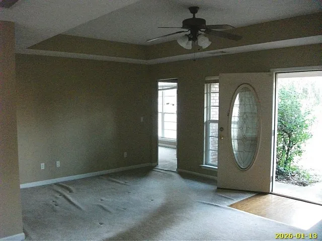 a view of an empty room with a window