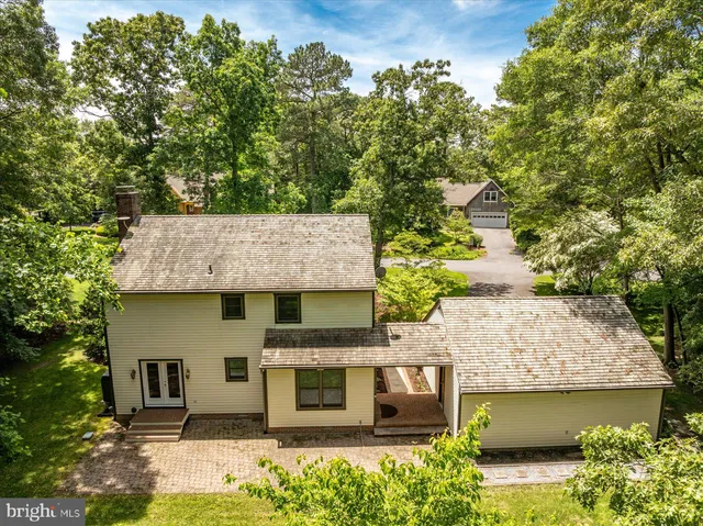 a side view of a house with a yard