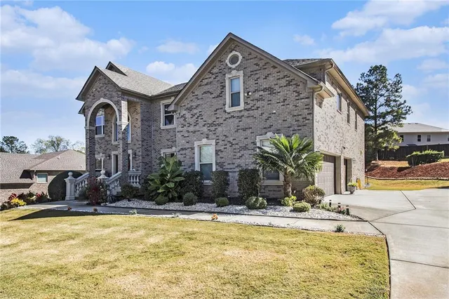 a swimming pool with outdoor seating and yard