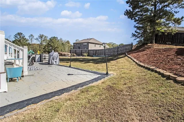 a view of a swimming pool with an outdoor seating