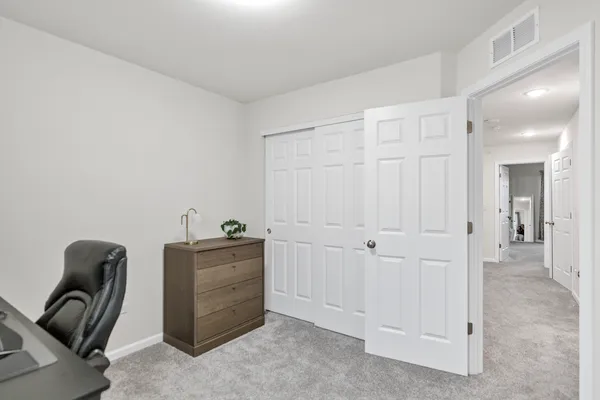 a hallway with cabinets
