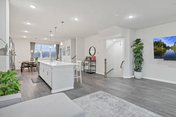 a view of a living room and kitchen