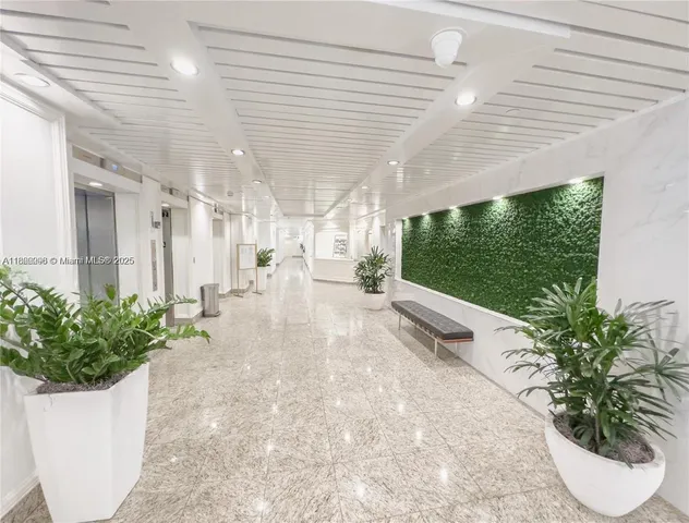 a view of a swimming pool with an outdoor space and seating area