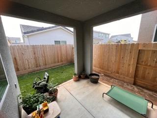 4106 Dennis Drive Clovis, CA 93619 - Photo 13 of 17 a backyard of a house with a garden
